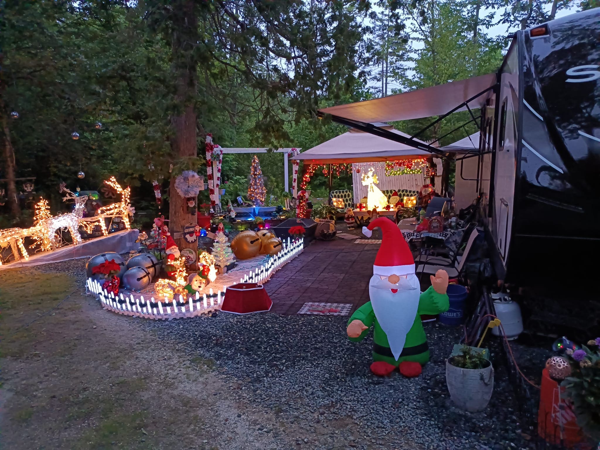 A gnome statue in the middle of an outdoor area.