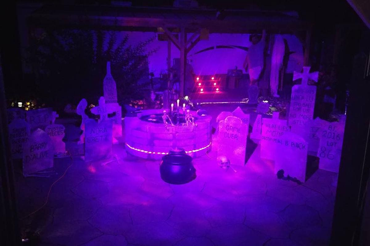 A purple light is shining in the dark.