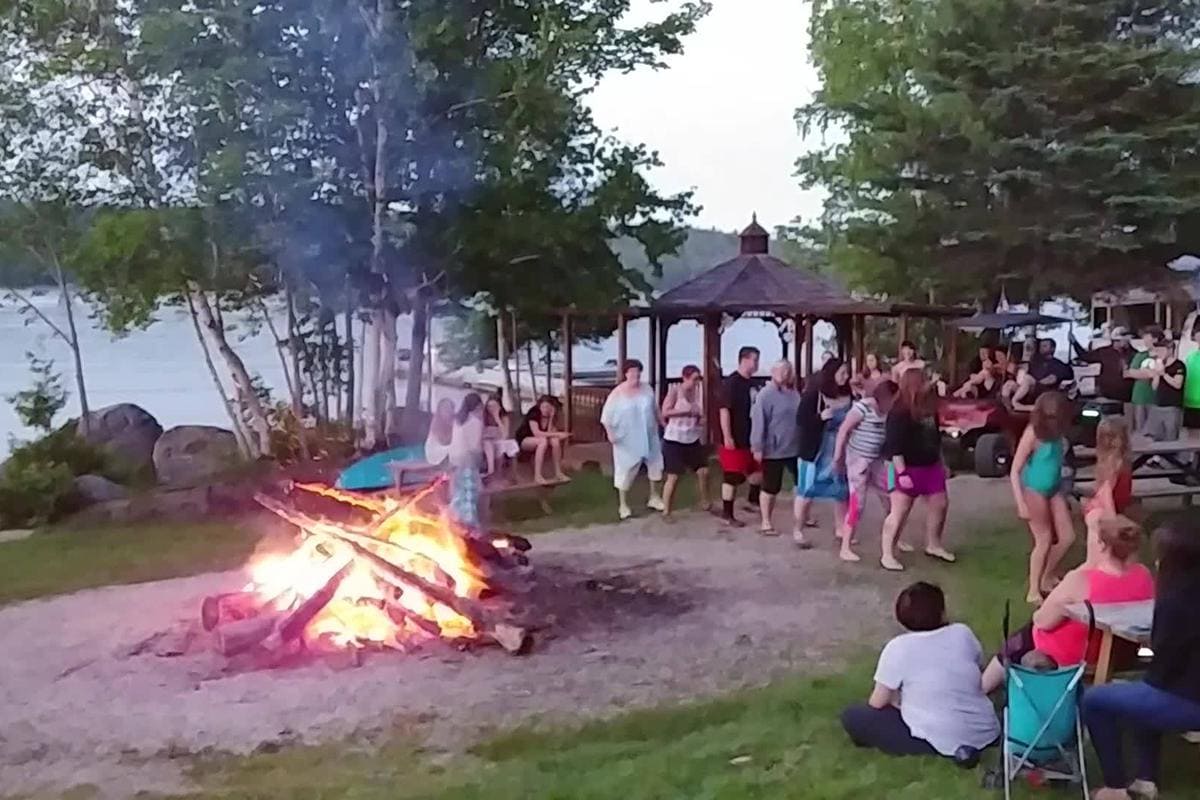 A group of people gathered around a fire.