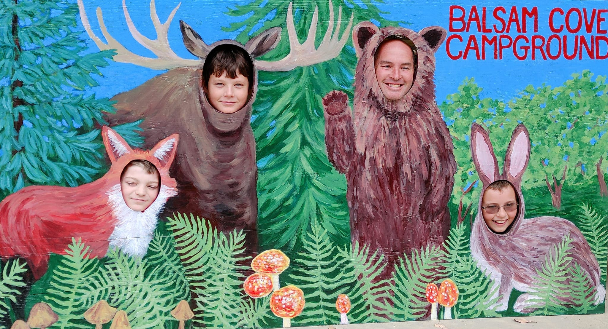 A group of people in costumes posing for a picture.