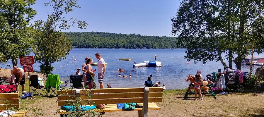 People enjoying a sunny day at lake.